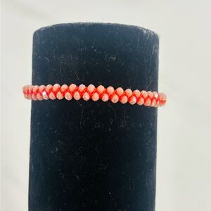 Handmade Woven Bracelet with Salmon-Colored Stones and Adjustable Orange Cord